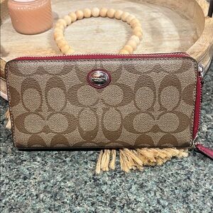 Coach Signature Canvas Zip-Around Wallet in Brown with Red Trim